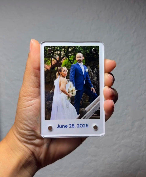 Polaroid acrylic magnet with personalized wedding photo held in hand